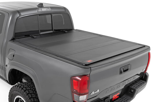Rough Country Hard Tri-Fold Flip Up Bed Cover | 6' Bed | Toyota Tacoma 2WD/4WD (2005-2015)
