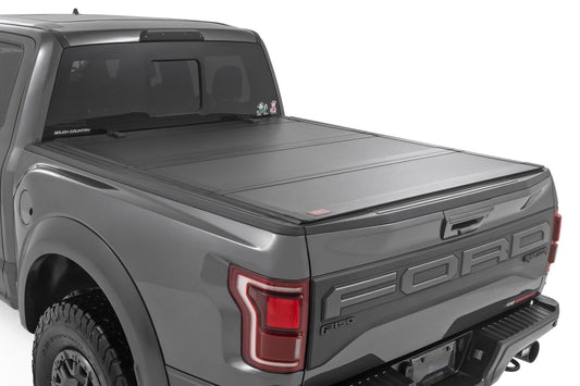 Rough Country Hard Tri-Fold Flip Up Bed Cover | 6'7" Bed | Ford F-150 2WD/4WD (2015-2025)
