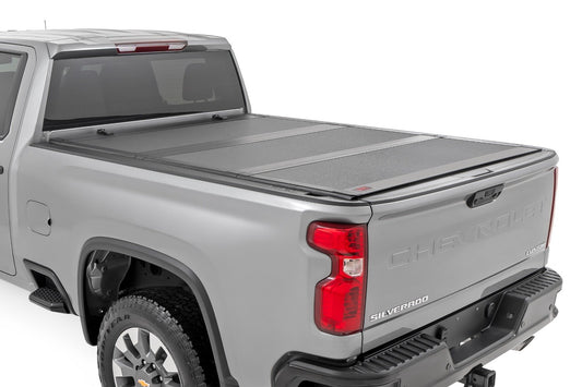 Rough Country Hard Tri-Fold Flip Up Bed Cover | 6'9" Bed | Chevy/GMC  Silverado/Sierra 2500HD/3500HD (20-26)